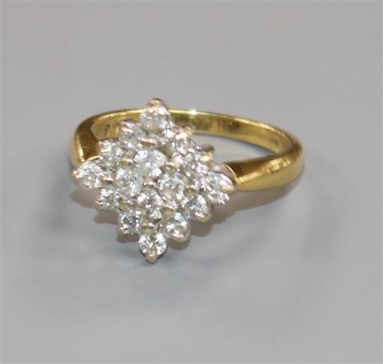 A modern 18ct gold and diamond cluster ring, size M.
